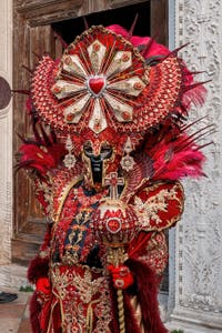 Venetian carnival costumed figures in front of the church of San Zaccaria.