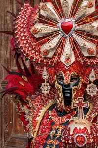 Venetian carnival costumed figures in front of the church of San Zaccaria.