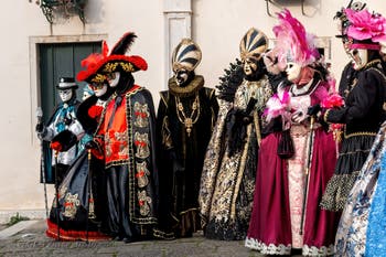 Venetian carnival costumed figures in front of the church of San Zaccaria.