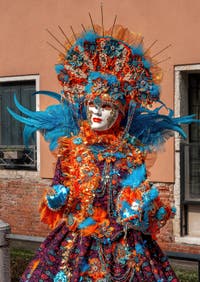 People in costume at the Venice carnival on Campo San Martin.