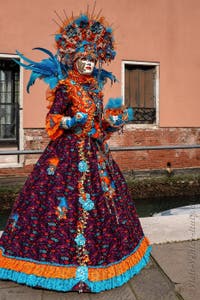 People in costume at the Venice carnival on Campo San Martin.