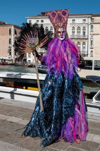 People in costume at the Venice carnival in front of the Madonna della Salute.