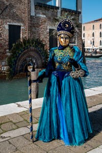 People in costume at the Venice carnival in front of the Madonna della Salute.