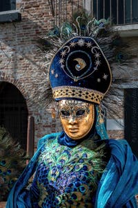 People in costume at the Venice carnival in front of the Madonna della Salute.