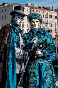 People in costume at the Venice carnival in front of the Madonna della Salute.