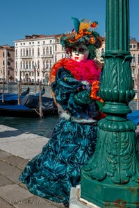 People in costume at the Venice carnival in front of the Madonna della Salute.