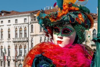 People in costume at the Venice carnival in front of the Madonna della Salute.