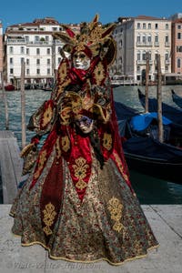 People in costume at the Venice carnival in front of the Madonna della Salute.