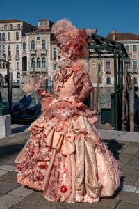 People in costume at the Venice carnival in front of the Madonna della Salute.