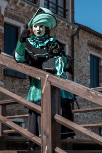 People in costume at the Venice carnival in front of the Madonna della Salute.