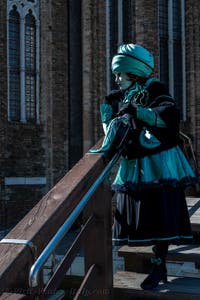 People in costume at the Venice carnival in front of the Madonna della Salute.