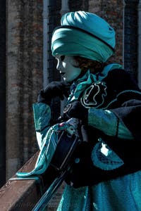 People in costume at the Venice carnival in front of the Madonna della Salute.