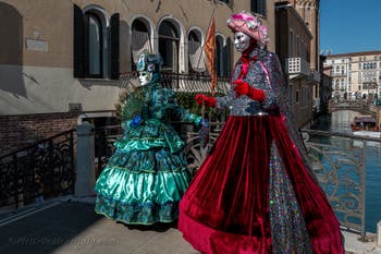 People in costume at the Venice carnival in front of the Madonna della Salute.