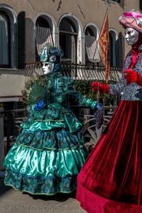 People in costume at the Venice carnival in front of the Madonna della Salute.