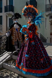 People in costume at the Venice carnival in front of the Madonna della Salute.