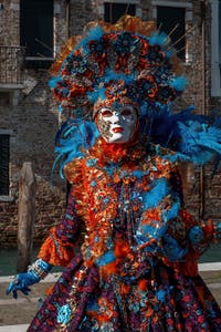 People in costume at the Venice carnival in front of the Madonna della Salute.