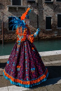 People in costume at the Venice carnival in front of the Madonna della Salute.