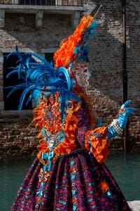 People in costume at the Venice carnival in front of the Madonna della Salute.