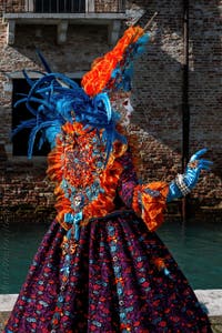 People in costume at the Venice carnival in front of the Madonna della Salute.