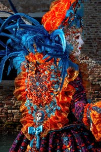 People in costume at the Venice carnival in front of the Madonna della Salute.