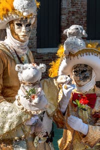 People in costume at the Venice carnival in front of the Madonna della Salute.