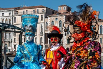 People in costume at the Venice carnival in front of the Madonna della Salute.