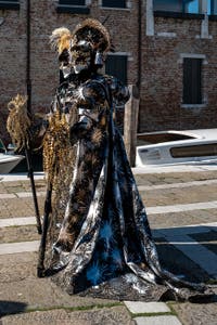 People in costume at the Venice carnival in front of the Madonna della Salute.