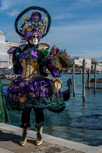 People in costume at the Venice carnival in front of the Madonna della Salute.