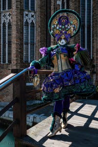 People in costume at the Venice carnival in front of the Madonna della Salute.