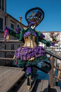 People in costume at the Venice carnival in front of the Madonna della Salute.