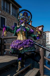 People in costume at the Venice carnival in front of the Madonna della Salute.