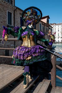 People in costume at the Venice carnival in front of the Madonna della Salute.