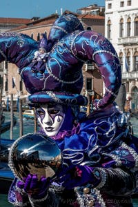 People in costume at the Venice carnival in front of the Madonna della Salute.