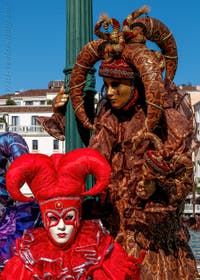 People in costume at the Venice carnival in front of the Madonna della Salute.