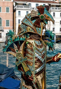 People in costume at the Venice carnival in front of the Madonna della Salute.