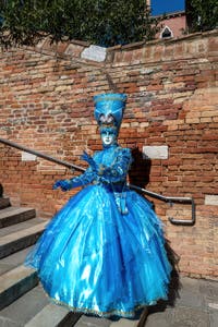 People in costume at the Venice carnival on Campiello Barbaro.