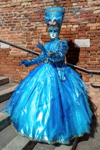 People in costume at the Venice carnival on Campiello Barbaro.