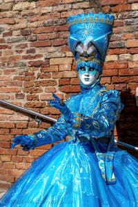 People in costume at the Venice carnival on Campiello Barbaro.