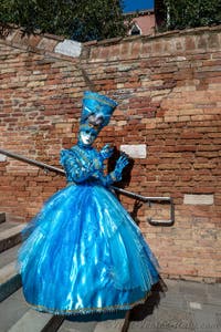 People in costume at the Venice carnival on Campiello Barbaro.