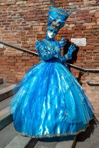 People in costume at the Venice carnival on Campiello Barbaro.