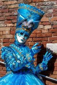 People in costume at the Venice carnival on Campiello Barbaro.