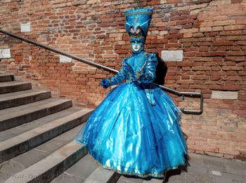 People in costume at the Venice carnival on Campiello Barbaro.