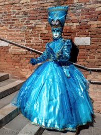 People in costume at the Venice carnival on Campiello Barbaro.