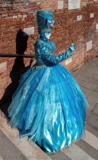 People in costume at the Venice carnival on Campiello Barbaro.