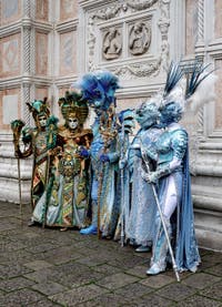 The parade of people in costume at the 2026 Venice Carnival in front of the Church of San Zaccaria.