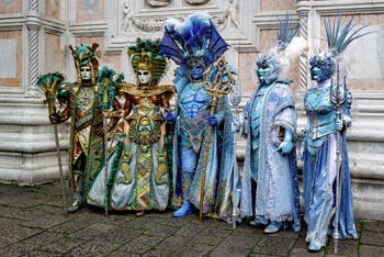 Venice carnival costumed figures