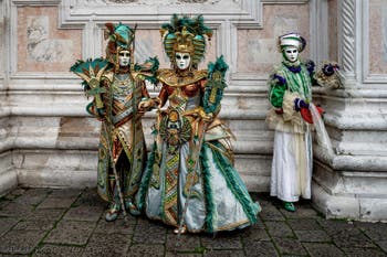 The parade of people in costume at the 2026 Venice Carnival in front of the Church of San Zaccaria.