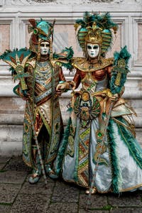 The parade of people in costume at the 2026 Venice Carnival in front of the Church of San Zaccaria.
