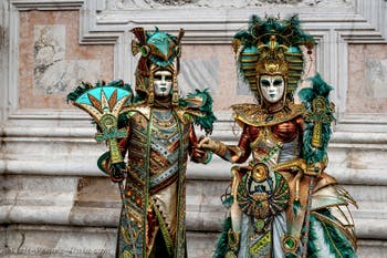 The parade of people in costume at the 2026 Venice Carnival in front of the Church of San Zaccaria.