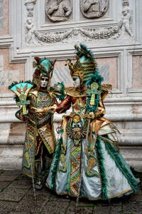 The parade of people in costume at the 2026 Venice Carnival in front of the Church of San Zaccaria.